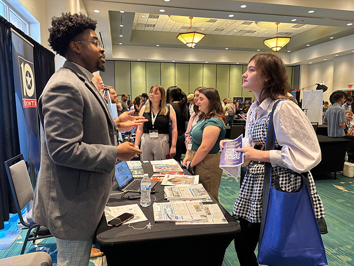 A recruiter from Granite Media Partners explains career options to a student at the 2025 Texas Intercollegiate Press Association on April 10 in San Marcos. The TIPA convention drew more than 400 attendees from across the state.